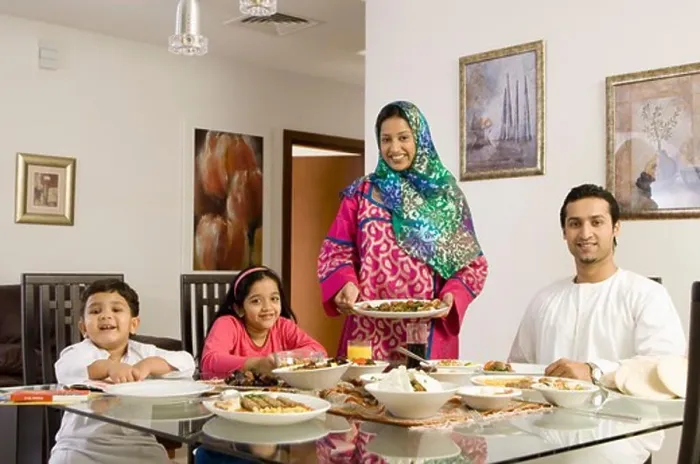 Framed Print : Arab Family looking at camera while dining Framed Print : Arab Family looking at camera while dining