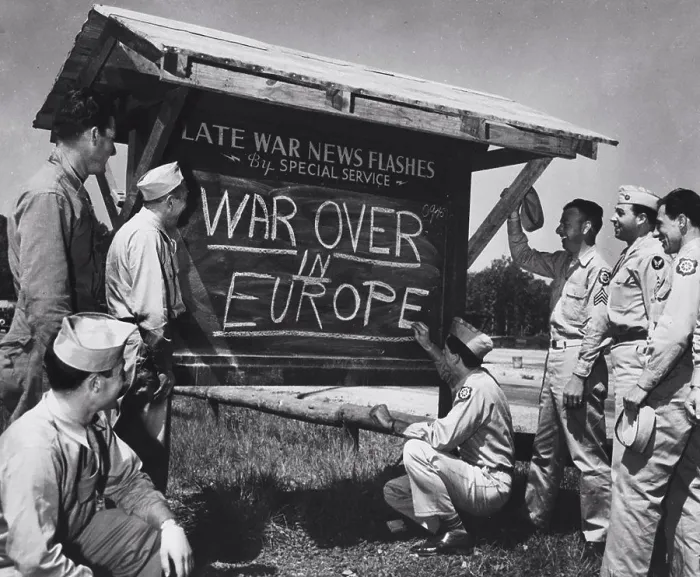 Framed Print : An Army private is shown breaking the news of the end of the war in Europe to other Soldiers after receiving an Framed Print : An Army private is shown breaking the news of the end of the war in Europe to other Soldiers after receiving an