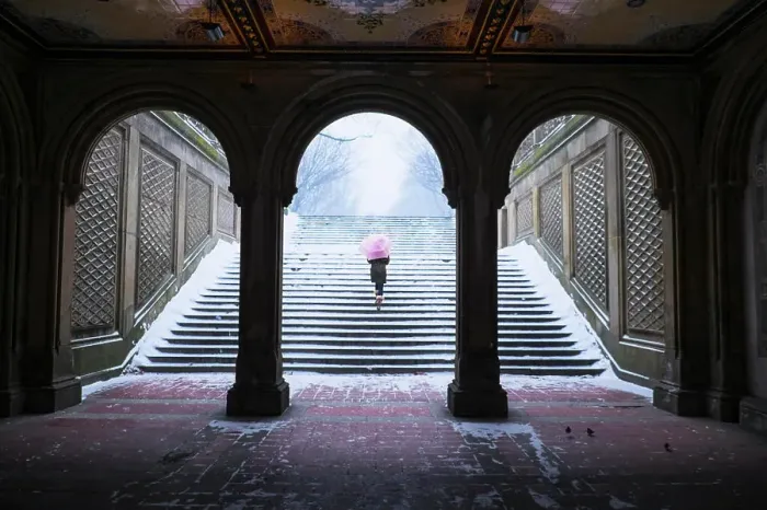 Framed Print : Asian woman walking up steps into snow Framed Print : Asian woman walking up steps into snow