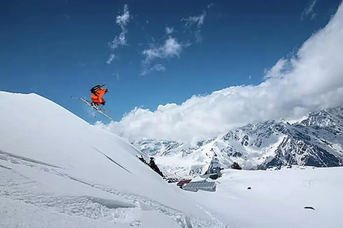 Framed Print : Athlete skier freestyle jumping in orange ski suit in snowy mountains on a sunny day Framed Print : Athlete skier freestyle jumping in orange ski suit in snowy mountains on a sunny day