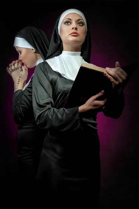 Framed Print : Two attractive young nuns with rosary and bible praying Two attractive young nuns with rosary and bible praying
