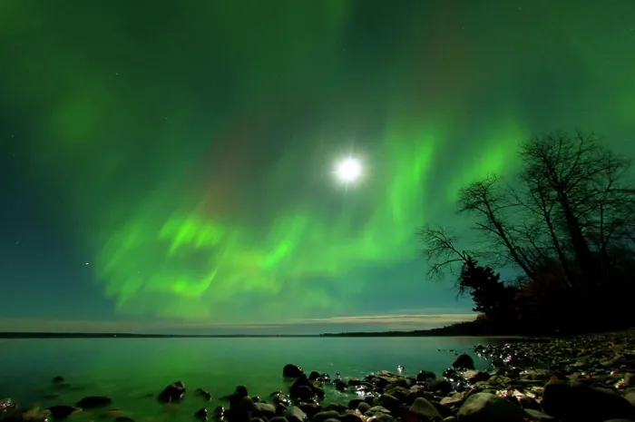 Framed Print : Aurora dancing over water at full moon in Clear lake Manitoba Canada Framed Print : Aurora dancing over water at full moon in Clear lake Manitoba Canada