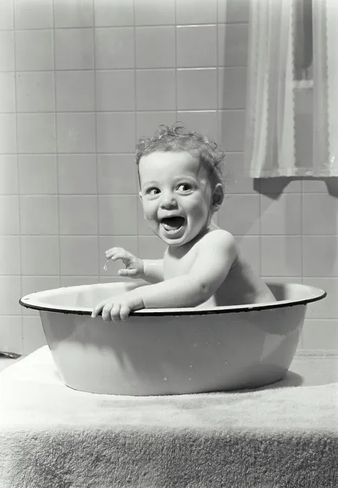 Framed Print : Baby sitting in a washtub Framed Print : Baby sitting in a washtub