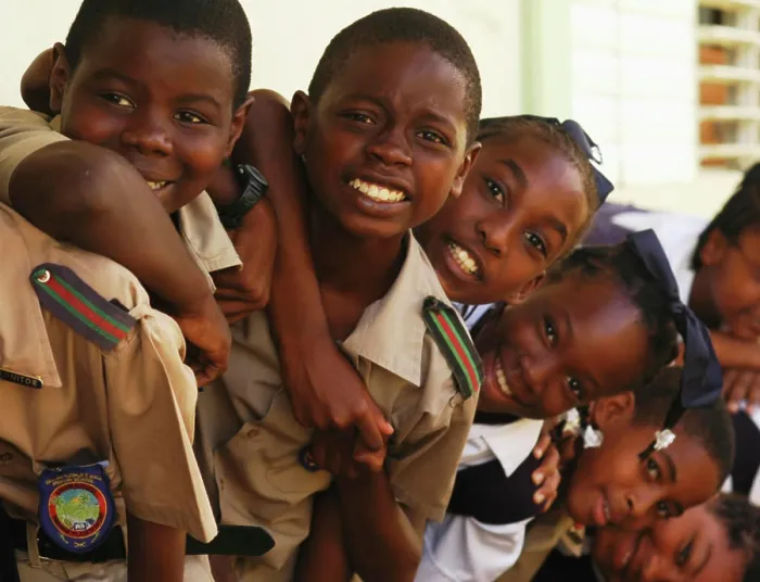 Framed Print : Barbados, Farmers, close-up of African schoolchildren smiling, standing one behind another, wearing school uniform (MR)