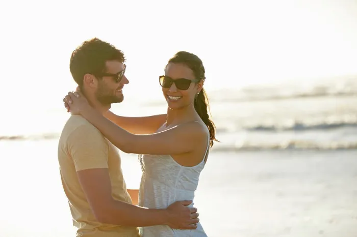 Framed Print : Beach, portrait and couple embrace with sunset