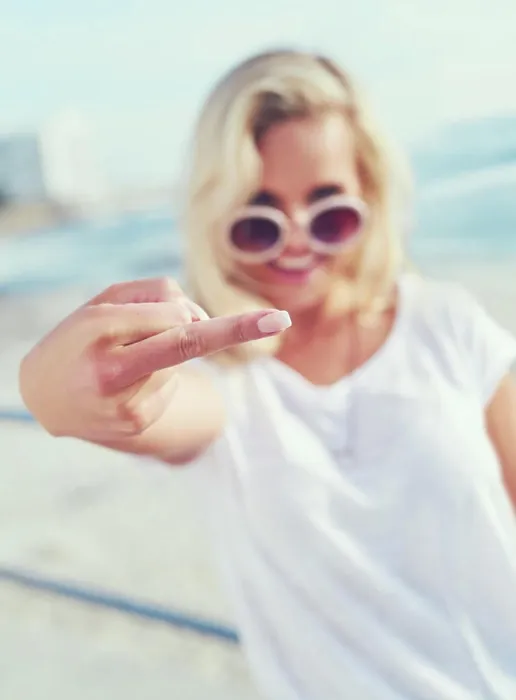 Framed Print : Beach, sunglasses and hand of woman with middle finger for rebel