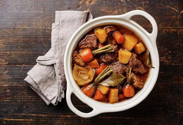 Framed Print : Beef meat stewed with potatoes, carrots and spices in ceramic pot on wooden background Framed Print : Beef meat stewed with potatoes, carrots and spices in ceramic pot on wooden background