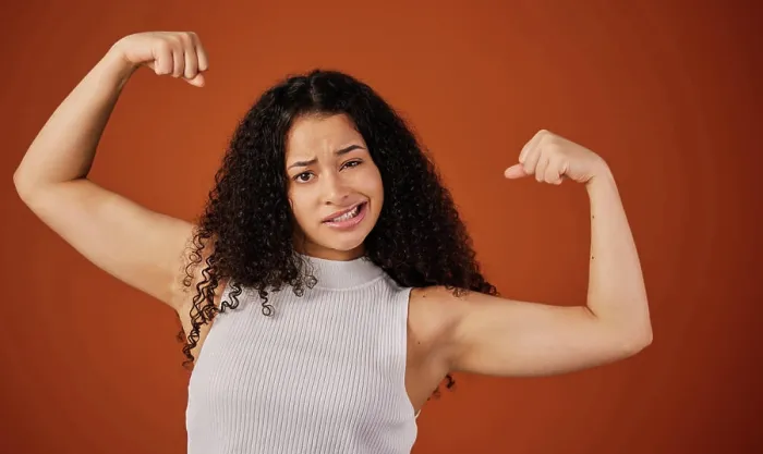 Framed Print : Bicep, flex and portrait of powerful woman in studio isolated on brown background for girl power Framed Print : Bicep, flex and portrait of powerful woman in studio isolated on brown background for girl power