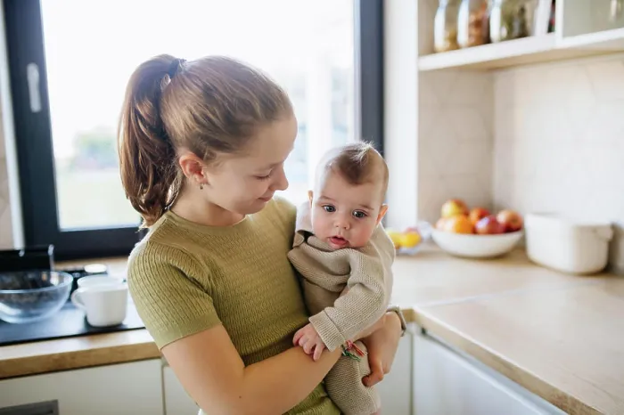Framed Print : Big sister holding in arms baby brother. Big sister holding in arms baby brother. Siblings. model released Framed Print : Big sister holding in arms baby brother. Big sister holding in arms baby brother. Siblings. model released