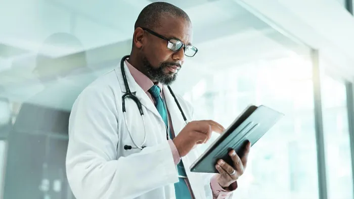 Framed Print : Black man, doctor and tablet for healthcare in hospital with medical research Framed Print : Black man, doctor and tablet for healthcare in hospital with medical research