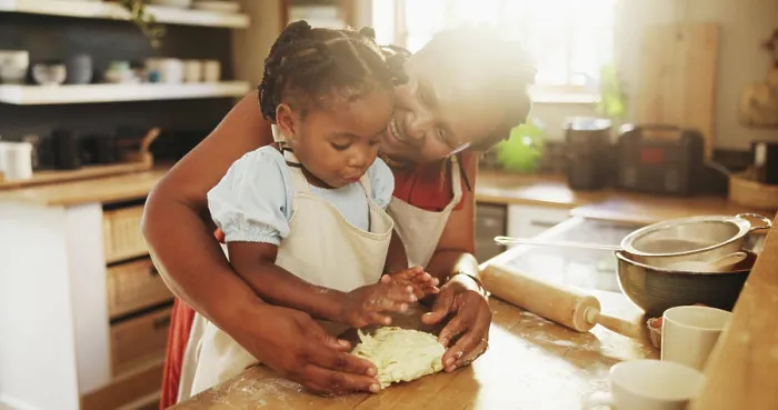 Framed Print : Black woman, child and teaching with dough Framed Print : Black woman, child and teaching with dough