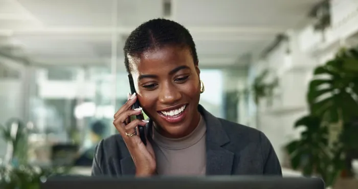 Framed Print : Black woman, phone call and plan on laptop in office Framed Print : Black woman, phone call and plan on laptop in office