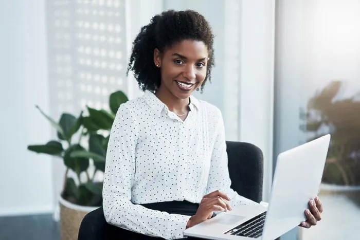 Framed Print : Black woman, portrait and laptop on lap in office for reading emails Framed Print : Black woman, portrait and laptop on lap in office for reading emails