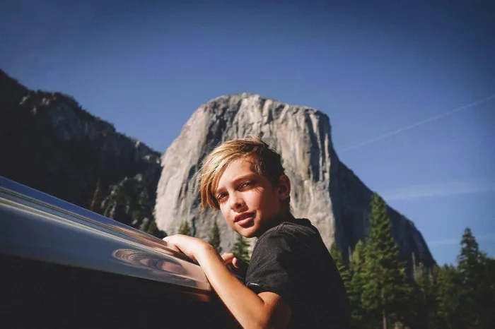 Framed Print : Blonde Boy Hangs from Car window with El Cap in the Background Framed Print : Blonde Boy Hangs from Car window with El Cap in the Background