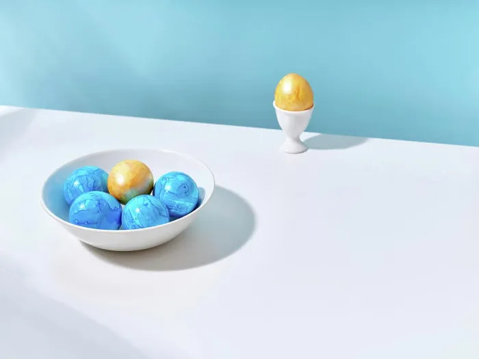 Framed Print : Blue and yellow Easter eggs in a bowl and in an egg cup Framed Print : Blue and yellow Easter eggs in a bowl and in an egg cup