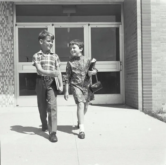 Framed Print : Boy and girl walking together