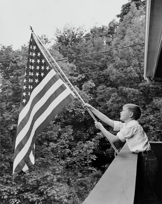 Framed Print : Boy holding an American flag, USA Framed Print : Boy holding an American flag, USA