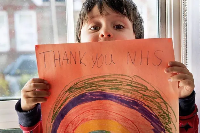 Framed Print : A boy holding up a drawing of a rainbow with the words Thank You NHS Framed Print : A boy holding up a drawing of a rainbow with the words Thank You NHS