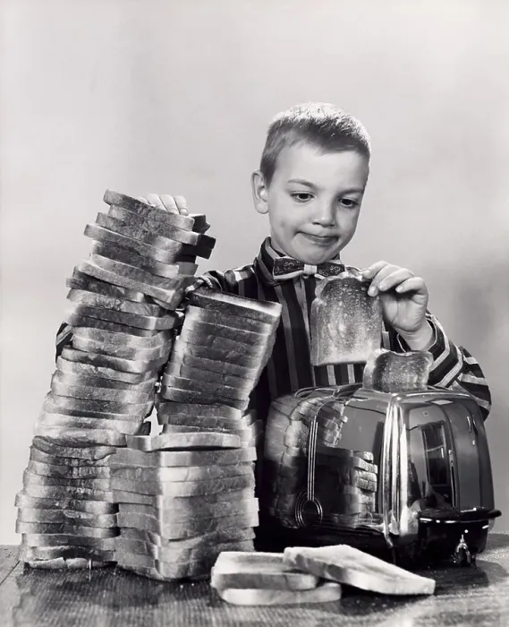 Framed Print : Boy making toast