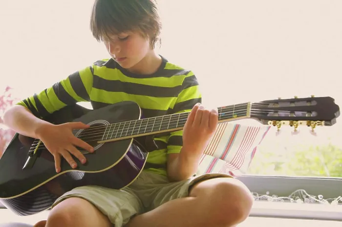 Framed Print : Boy Playing Guitar Framed Print : Boy Playing Guitar