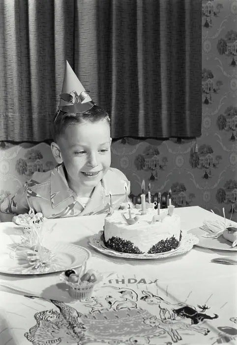 Framed Print : Boy sitting in front of a birthday cake