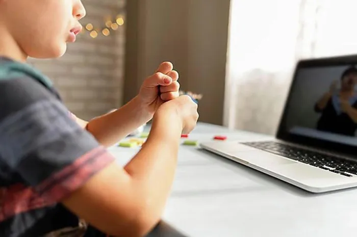 Framed Print : Boy talking with his teacher online school Framed Print : Boy talking with his teacher online school