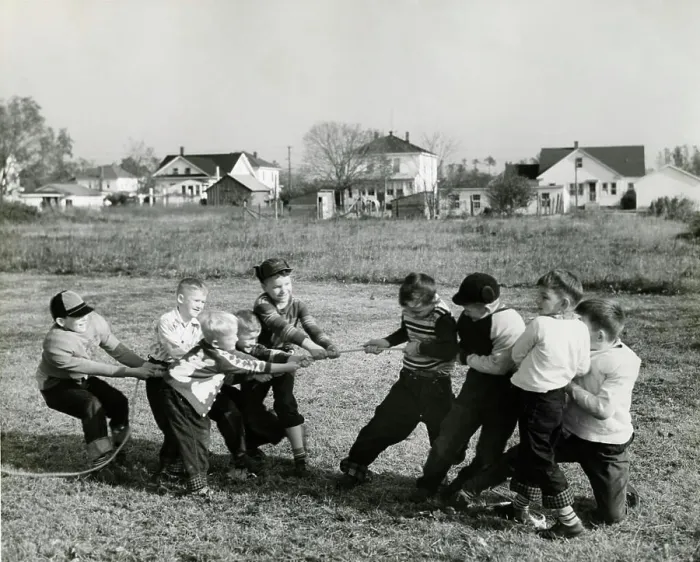 Framed Print : Boys pulling rope on field Framed Print : Boys pulling rope on field