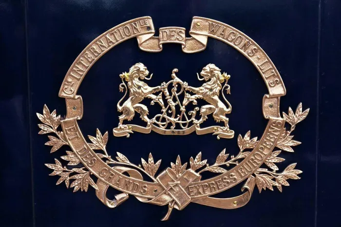 Framed Print : Brass crest on the side of a Venice Simplon Orient Express train carriage, heading to Venice, Italy