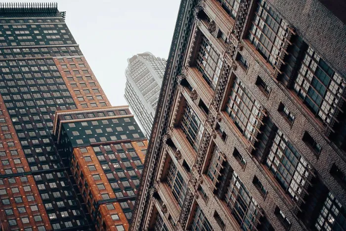 Framed Print : Two brick high rise buildings in Manhattan in front of a skyscraper on a foggy morning Framed Print : Two brick high rise buildings in Manhattan in front of a skyscraper on a foggy morning