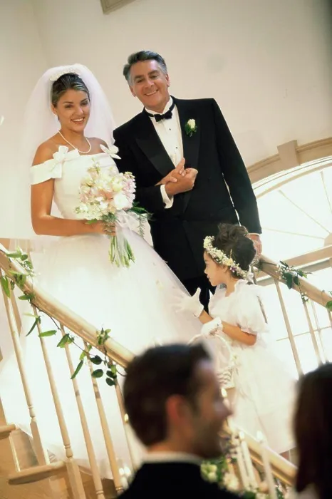 Framed Print : Bride walking down stairs with her father
