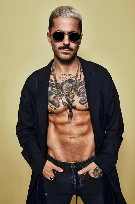 Framed Print : Brutal muscular sexy fit male with tattooed torso wearing black coat