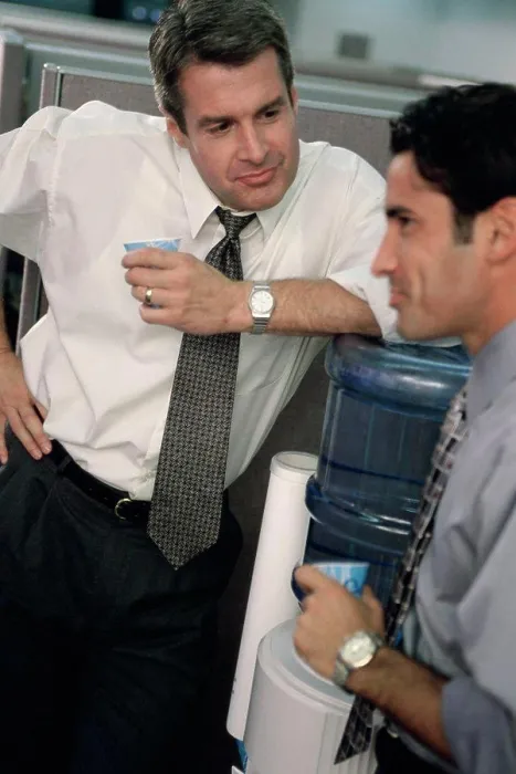 Framed Print : Two business executives talking at a water cooler Framed Print : Two business executives talking at a water cooler