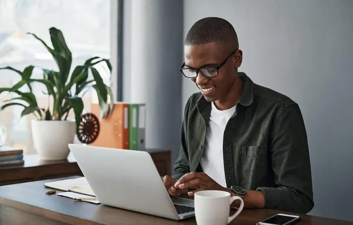 Framed Print : Business, laptop and happy black man typing in office for software