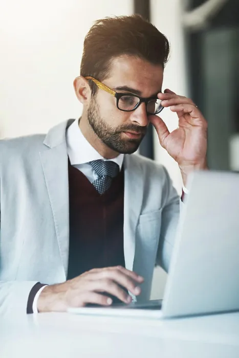 Framed Print : Business man, reading and laptop in office for compliance Framed Print : Business man, reading and laptop in office for compliance