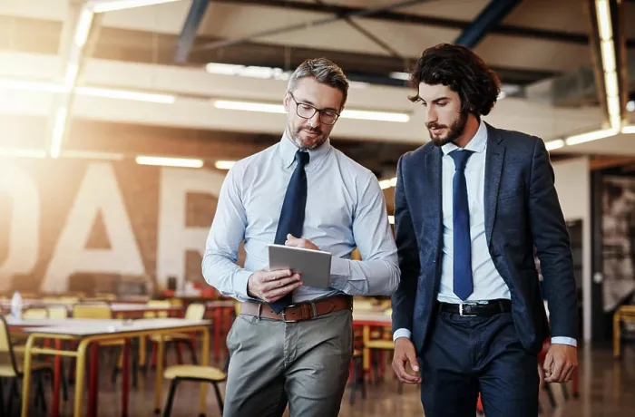 Framed Print : Business people, tablet and talking or walking in office with discussion for project management and client briefing