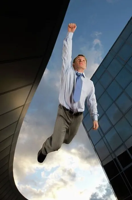 Framed Print : Businessman flying overtop of the city Framed Print : Businessman flying overtop of the city