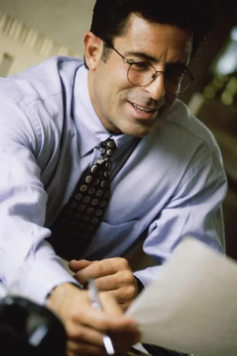 Framed Print : Businessman holding a sheet of paper Framed Print : Businessman holding a sheet of paper