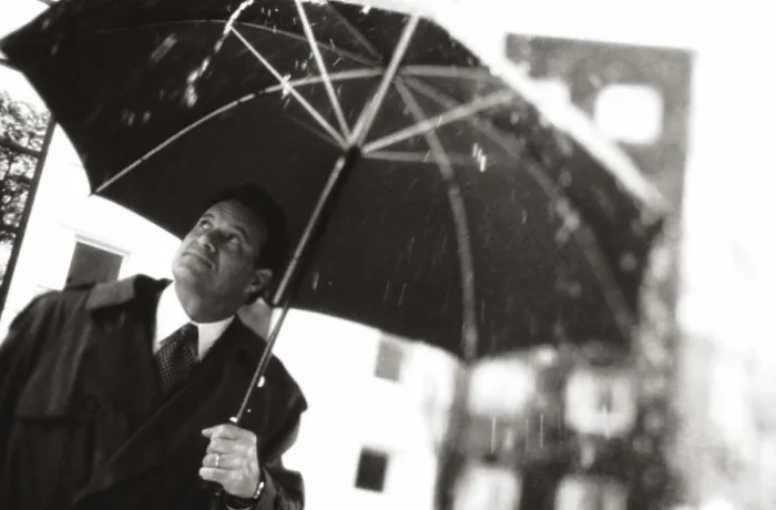 Framed Print : Businessman holding an umbrella Framed Print : Businessman holding an umbrella