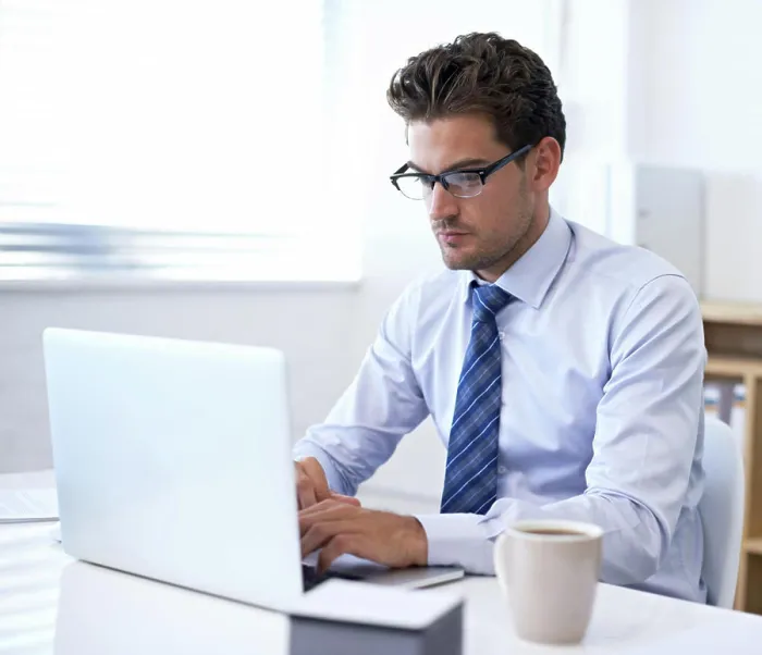 Framed Print : Businessman, laptop and typing in office for online communication as financial consultant