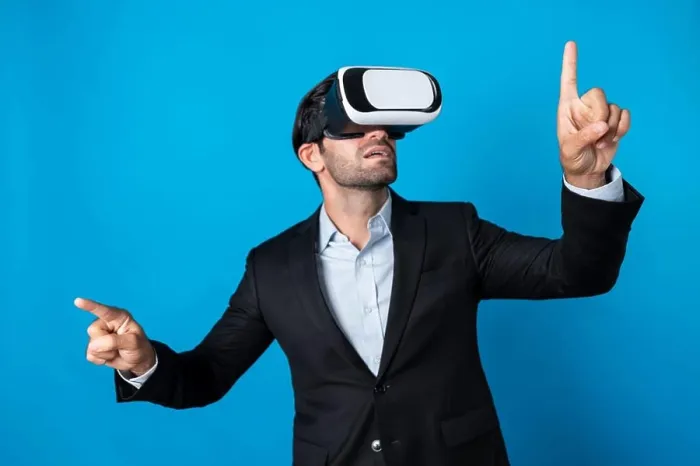 Framed Print : Businessman looking at data analysis while wearing VR glass and suit. Deviation