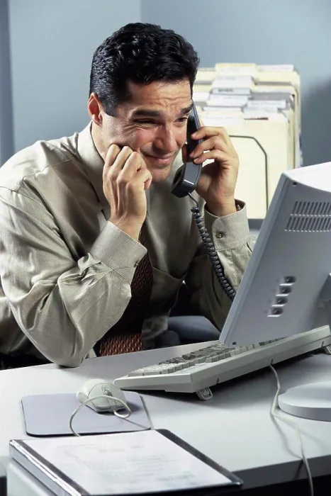 Framed Print : Businessman talking on a landline telephone Framed Print : Businessman talking on a landline telephone