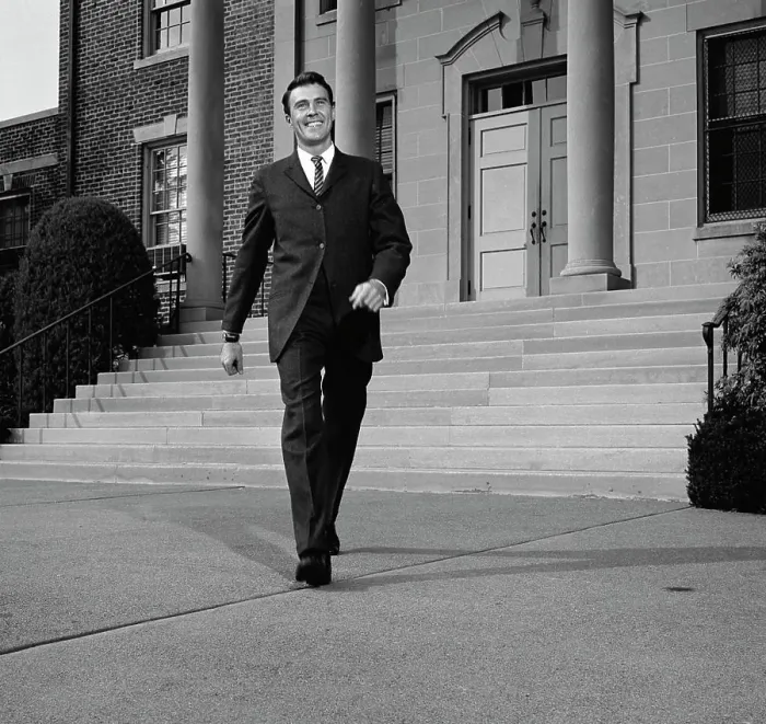 Framed Print : Businessman walking from courthouse Framed Print : Businessman walking from courthouse