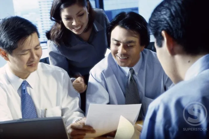 Framed Print : Businesswoman with three businessmen in an office Framed Print : Businesswoman with three businessmen in an office
