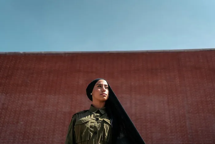 Framed Print : Bussiness muslim woman on a train station