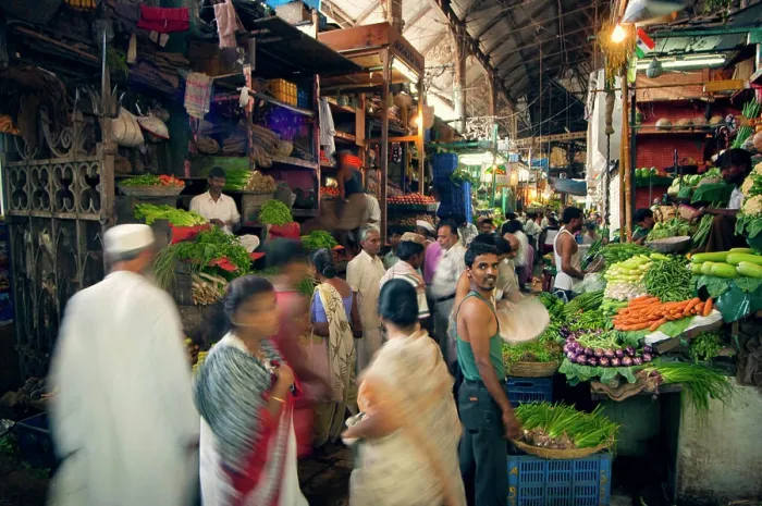 Framed Print : Bustling market scene with vibrant vegetable stalls and shoppers in motion