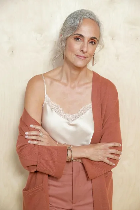 Framed Print : Calmly, a middle-aged woman with gray hair looks into camera Framed Print : Calmly, a middle-aged woman with gray hair looks into camera