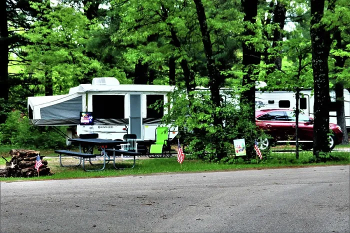 Framed Print : A camper is set up at a campsite May 26