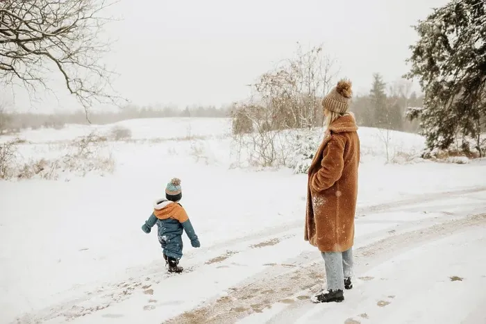 Framed Print : Canada, Ontario, Mother and son on snowy road