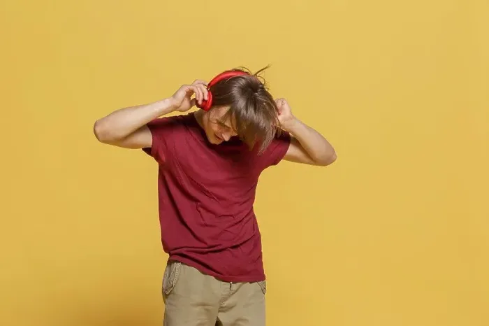 Framed Print : Carefree young man with headphones listening to music Framed Print : Carefree young man with headphones listening to music