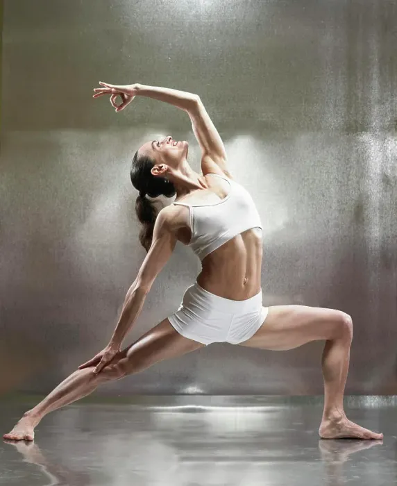 Framed Print : A caucasian female performs yoga in a studio
